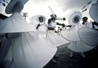 Revelers in the Trinidad Carnival dance across the stage in Port of Spain. The costumes were designed by Minshall, the most famous of carnival designers in the Carribean. This is Callaloo from 1984.